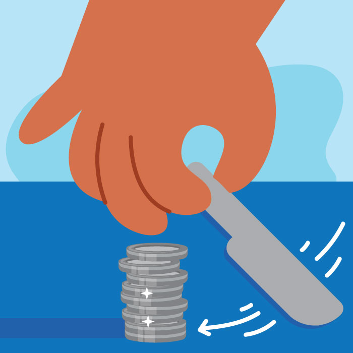 hand moving a knife toward a stack of coins